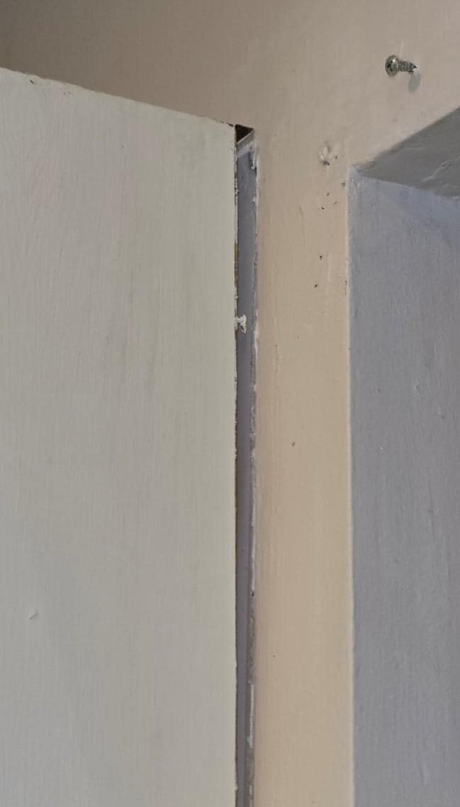 Kitchen cabinet falling off wall closeup