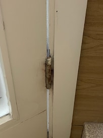 Rusty hinges in bathroom