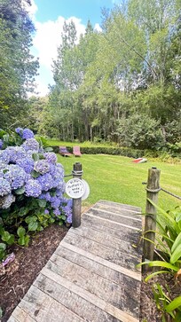 Gorgeous private garden area with corn hole and lounger