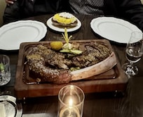 Tomahawk steak at the Bull & Bourbon Steakhouse with twice baked potato