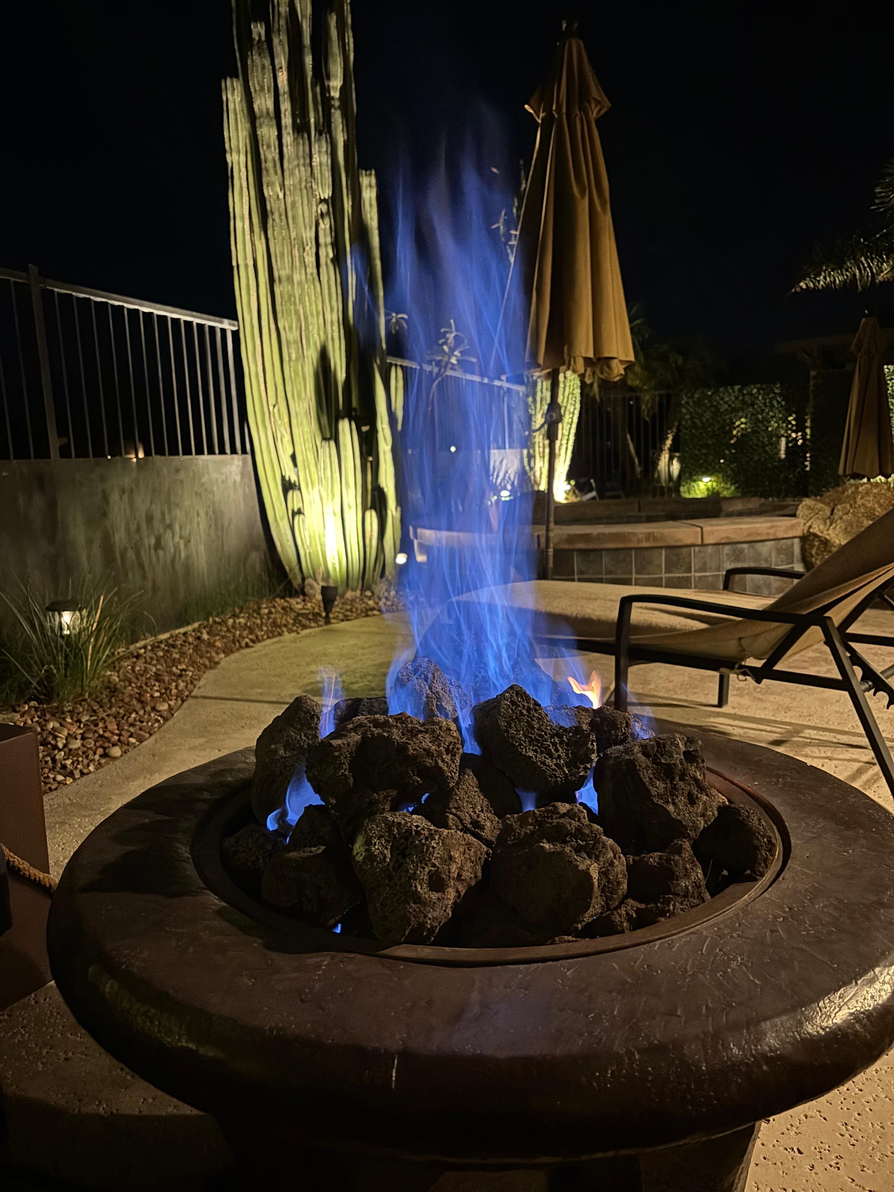 Adjustable fire pit on the patio with cushioned surround seating for those cooler November nights.
