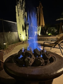 Adjustable fire pit on the patio with cushioned surround seating for those cooler November nights.