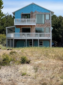 The house coming back form the beach, you can see lots of yet to be painted siding from this side. Perhaps replacing windows and/or dry rot, but not quite finished.