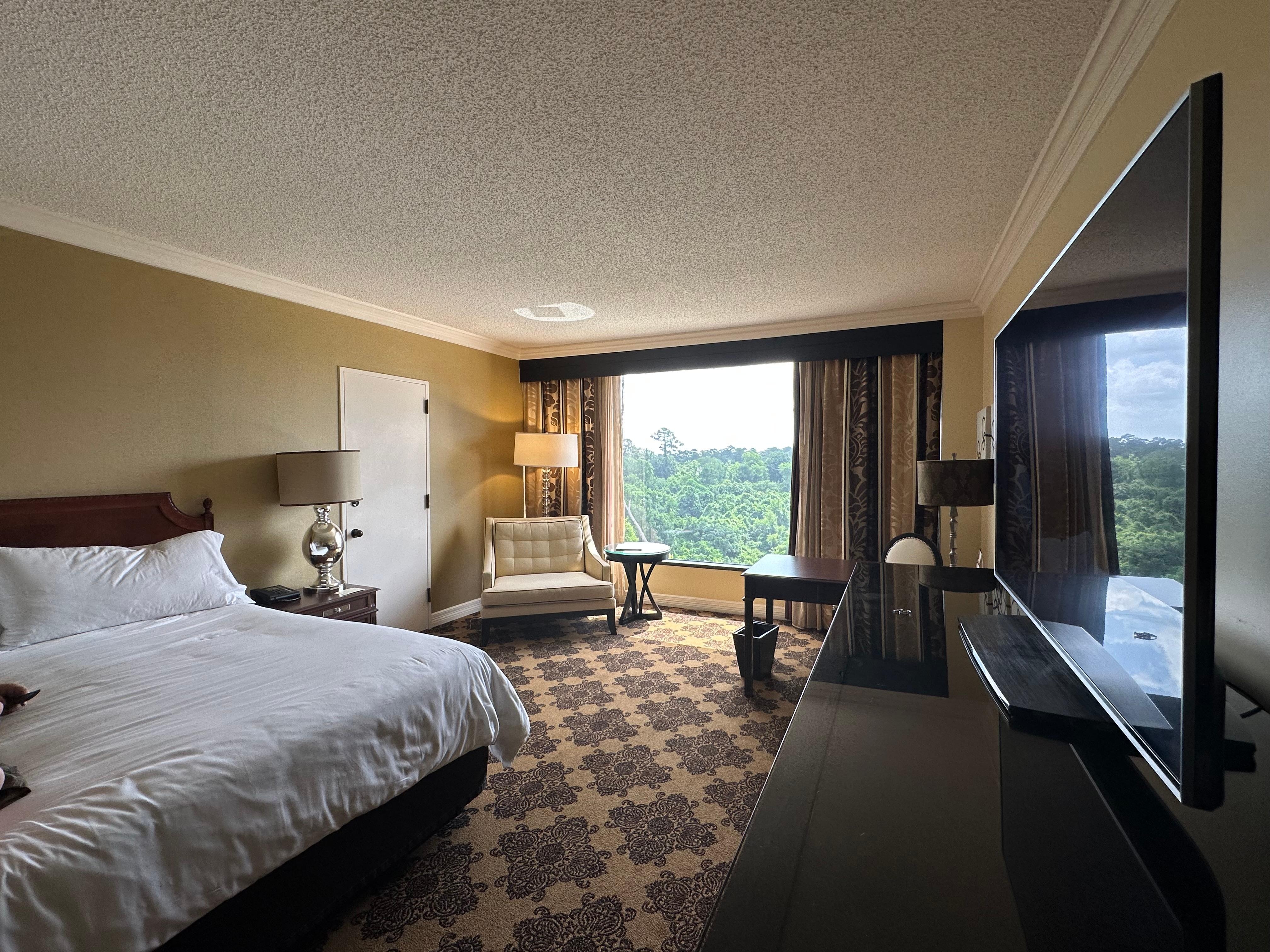 King size bed, oversized chair, entertainment center, writing desk