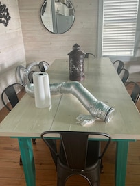 Unsanitary dryer vent and dirty rag on dining table