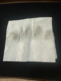 Paper towel used to wipe water off of the floor in the kitchen, showing how dirty the floor was.