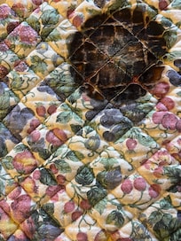 Coffee maker sized mark on mat. Presumably coffee maker spoilt so new one bought