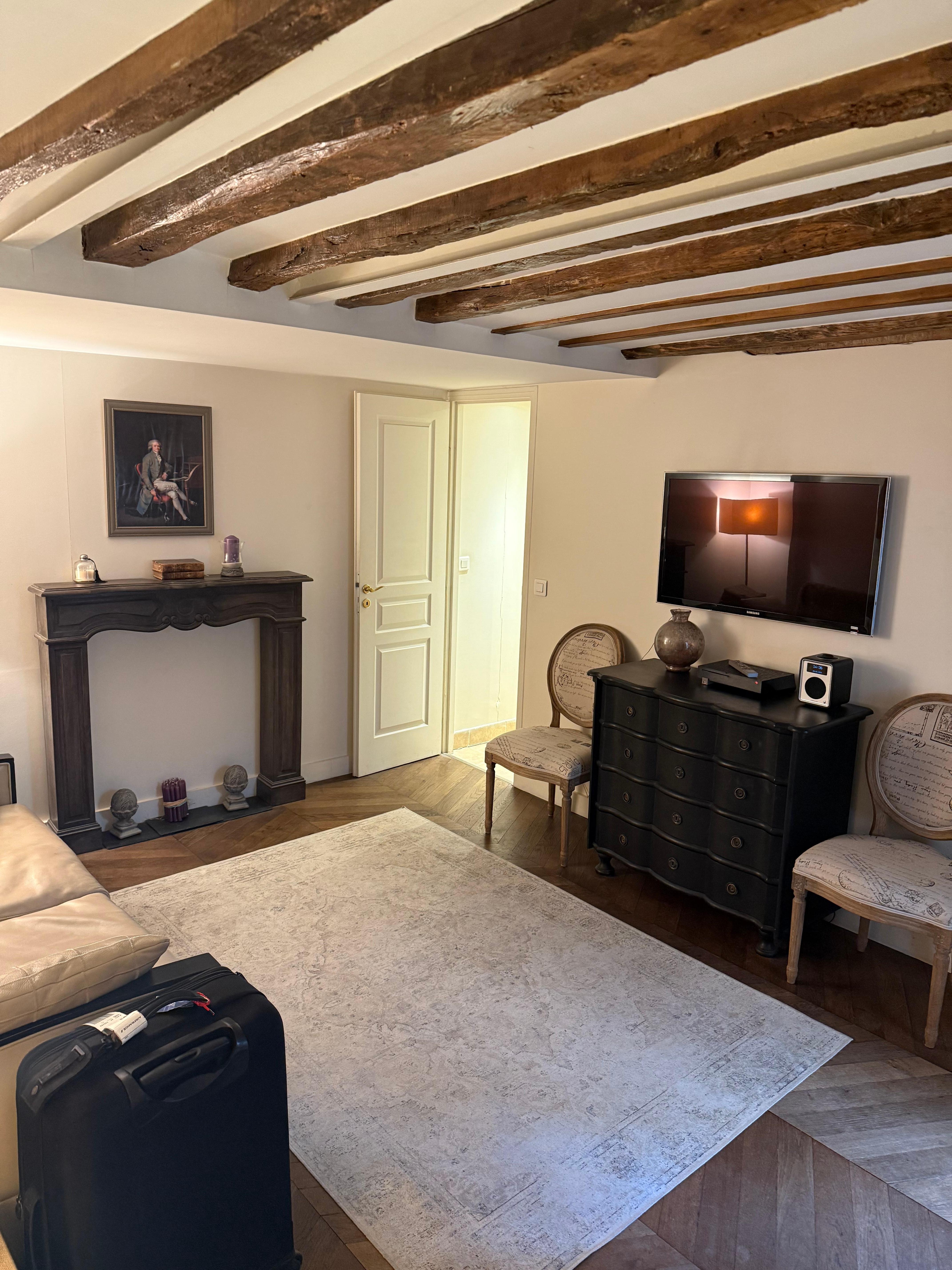 The cosy living room, with the portrait of Robespierre over the mantelpiece