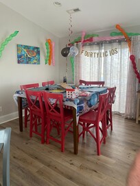 Big table seating plus eating bar and small kitchen table