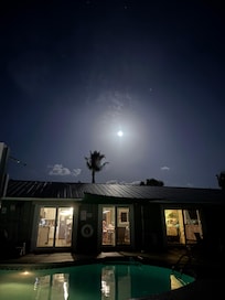 Full Moon rising over the house and pool.