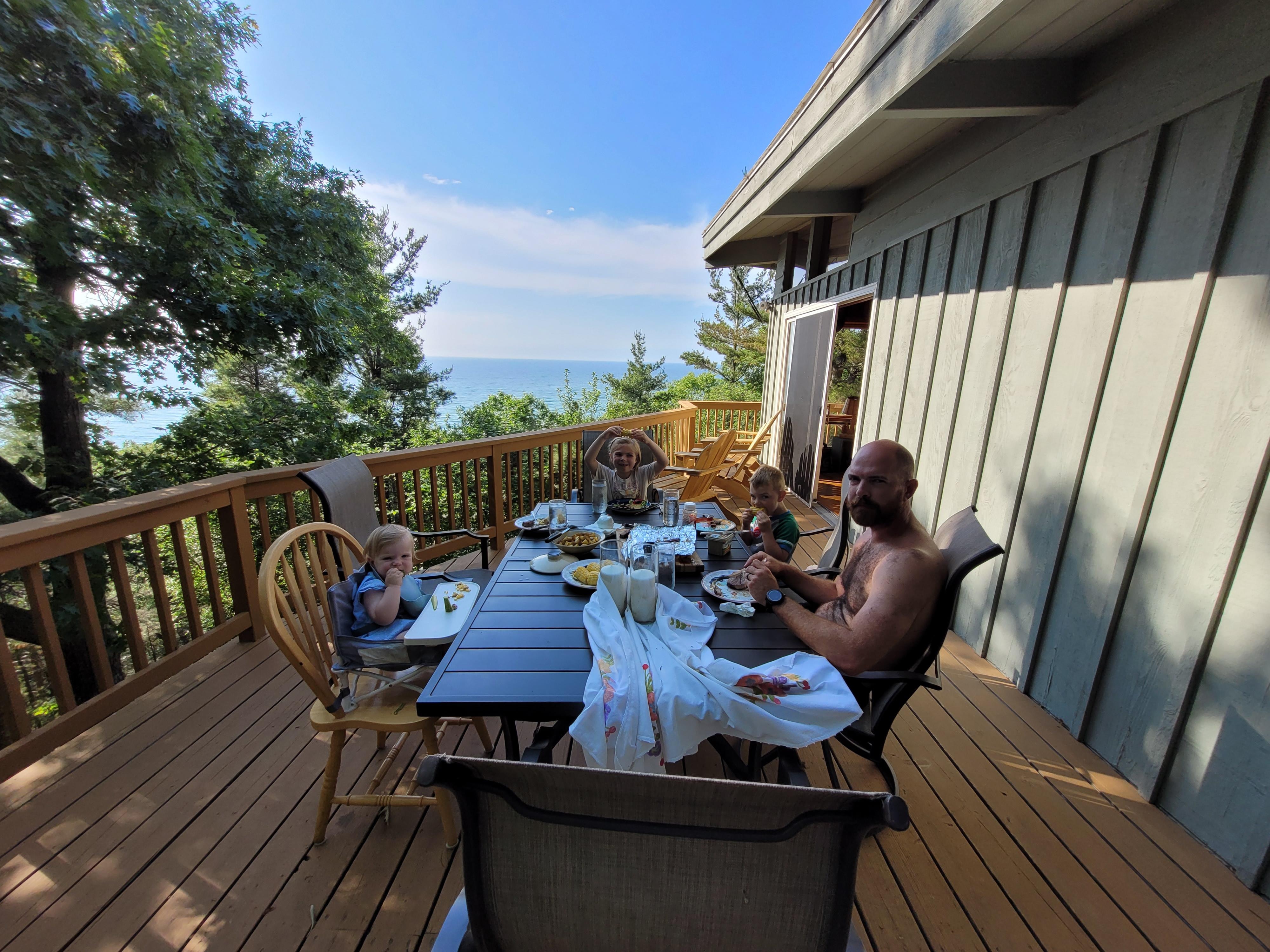 Dinner with a view! Well stocked kitchen and grill for preparing meals at the cottage.