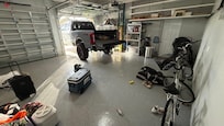 Two car garage with Bicycles, cooler, beach chairs, and other equipment available for use.