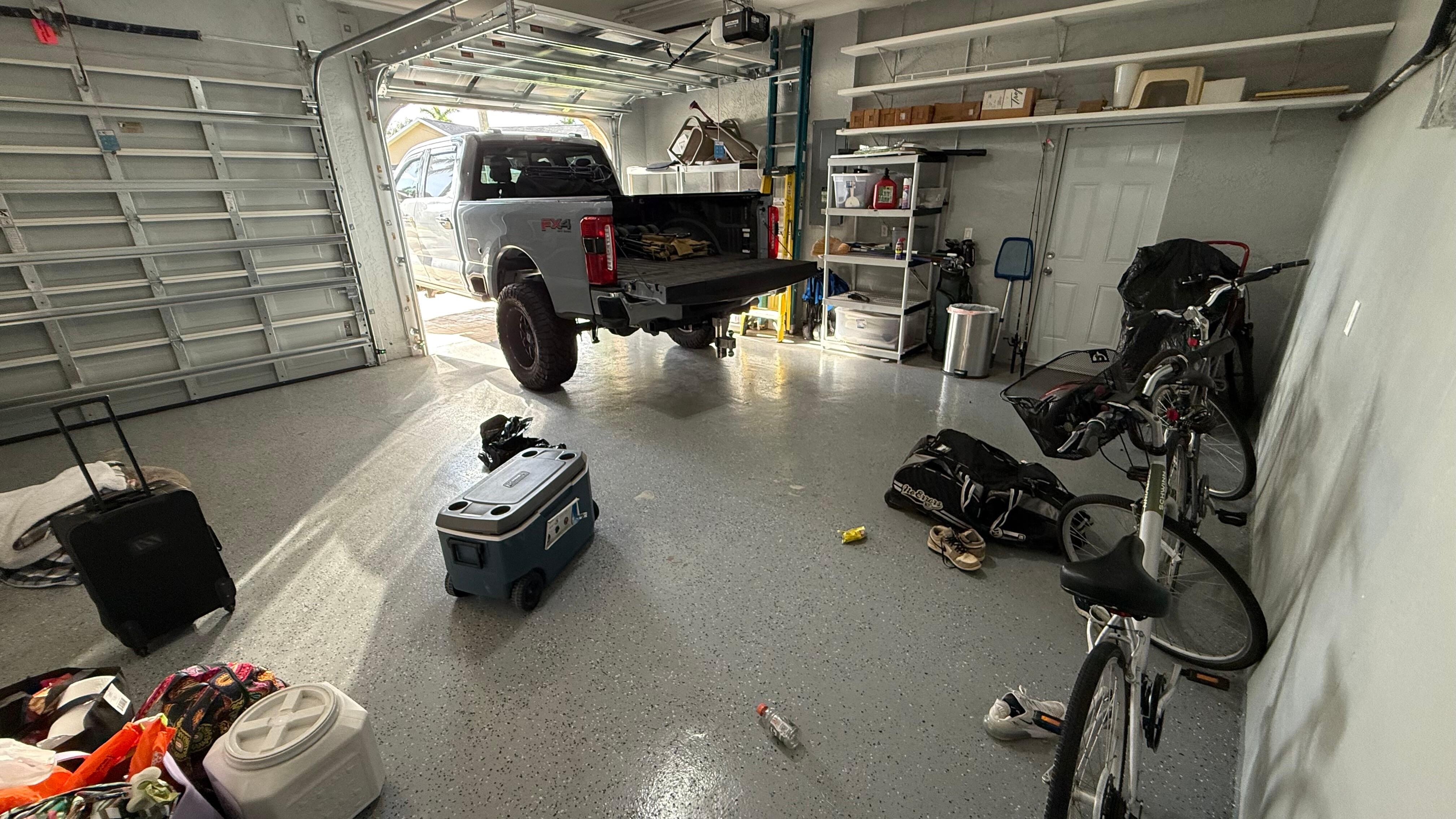Two car garage with Bicycles, cooler,  beach chairs, and other equipment available for use. 