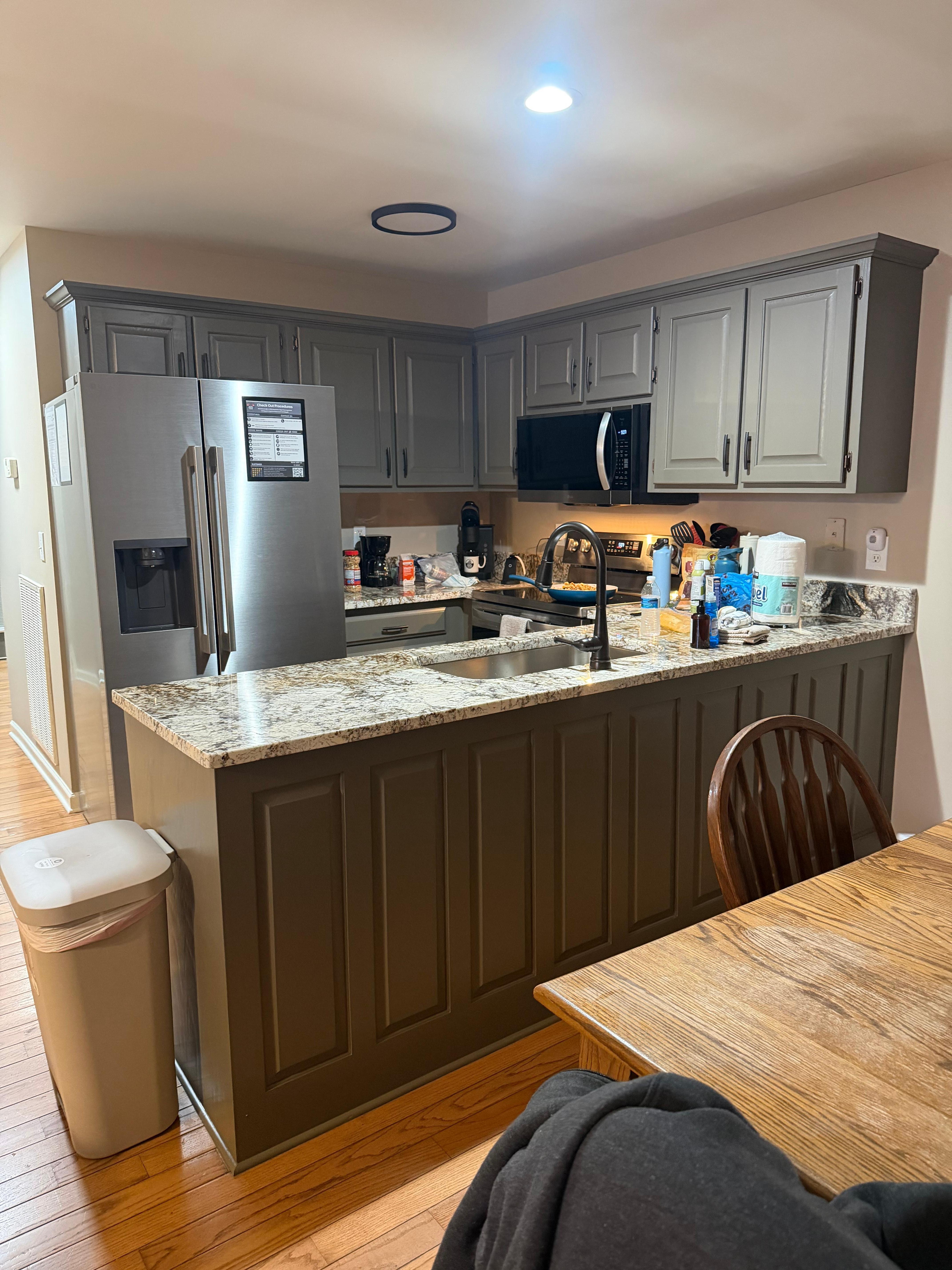 The kitchen is so cozy and all the appliances are stainless steel.