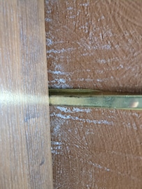 White mould growing up wall above bedside table. Turn photo 90 degrees.