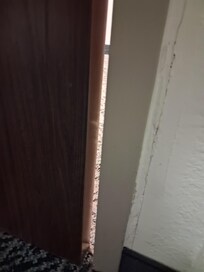Door is locked and there is this much of a gap between the door and the doorframe.