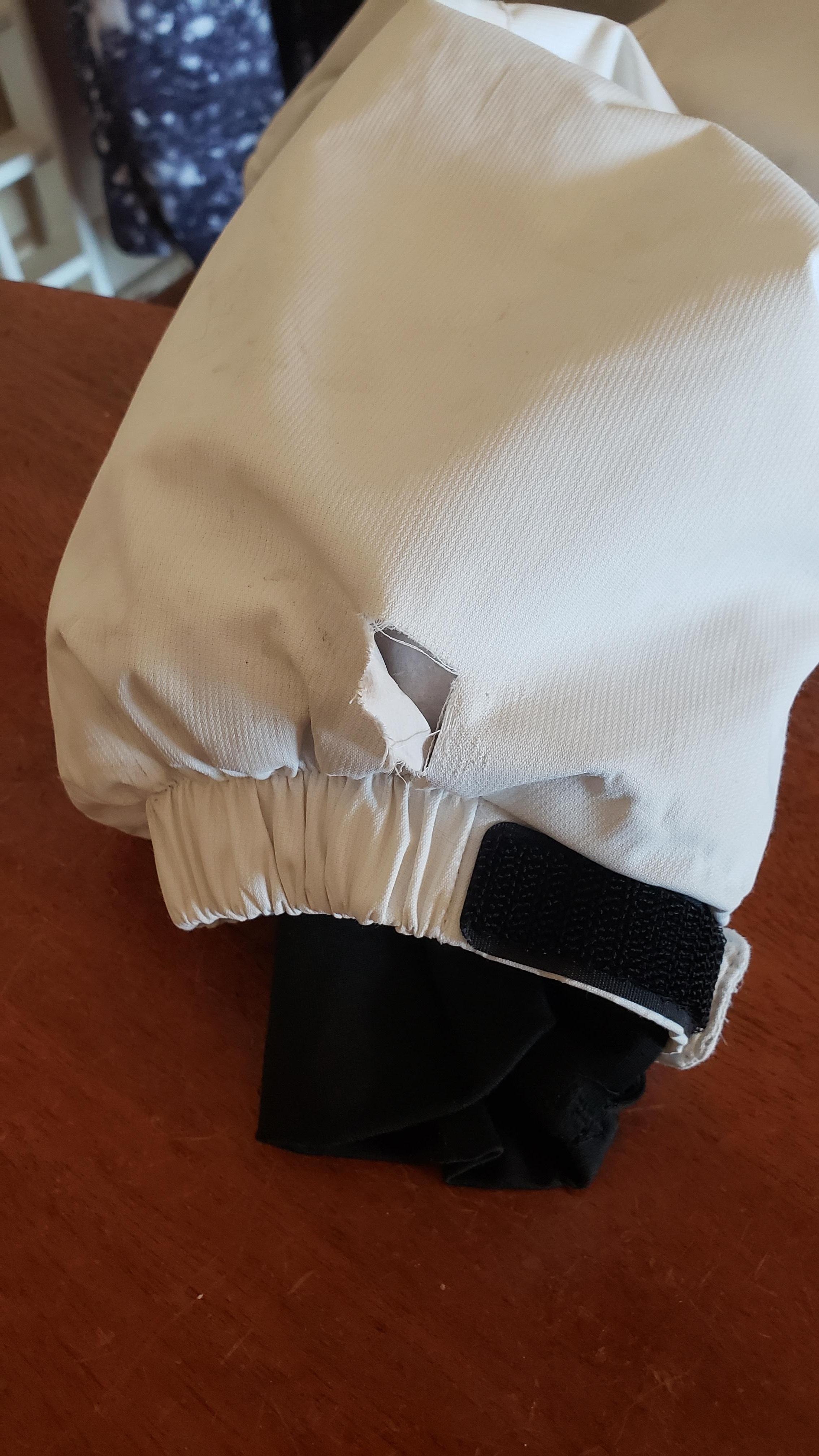 The tear the dog left when biting me, greatful I had it on or it would have punctured skin for sure!