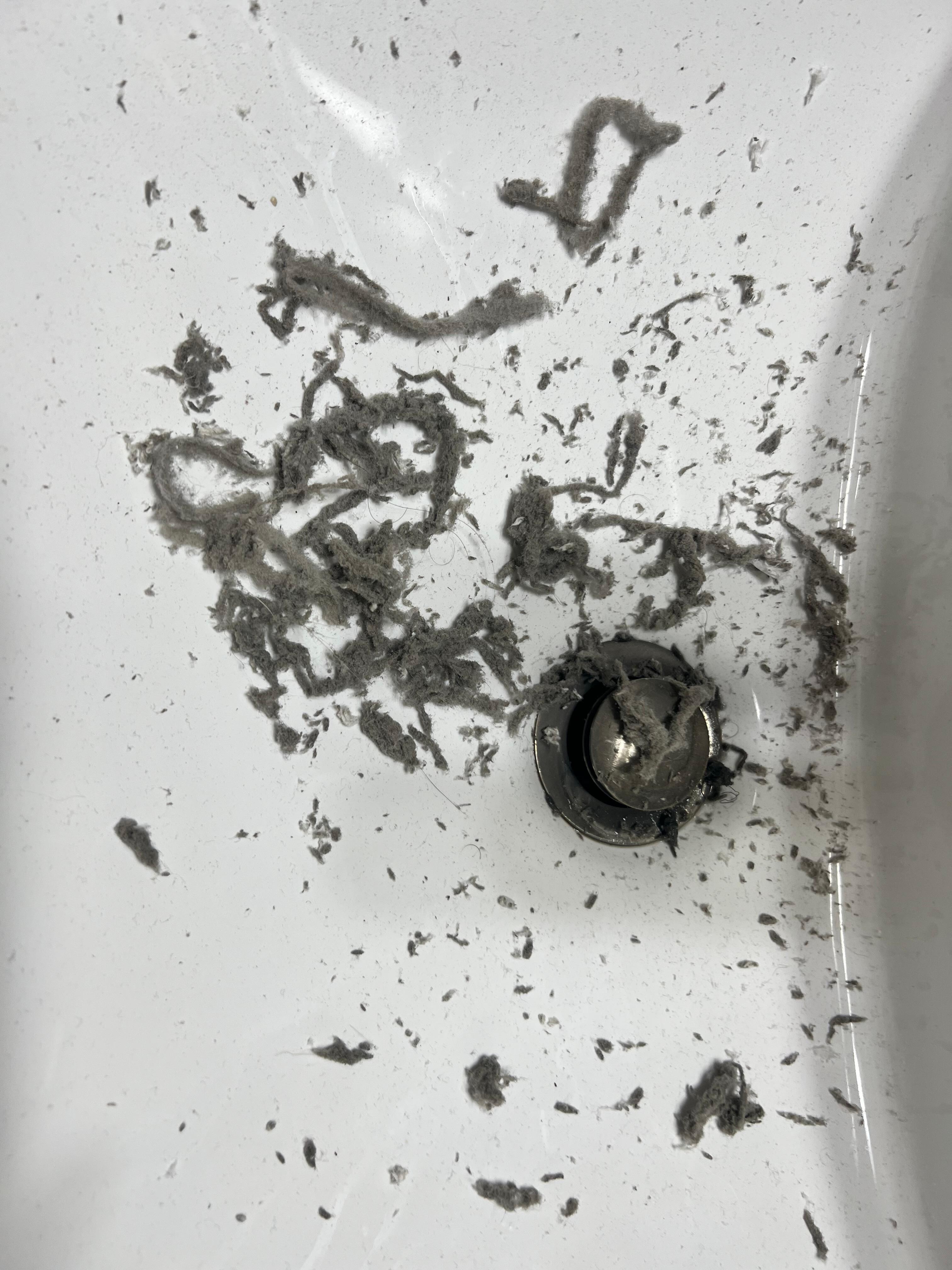 Moldy lint from AC unit.  Had to scrub the front filters with soap and water