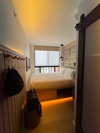 queen room; underbed storage, compact space but good for solo travelers