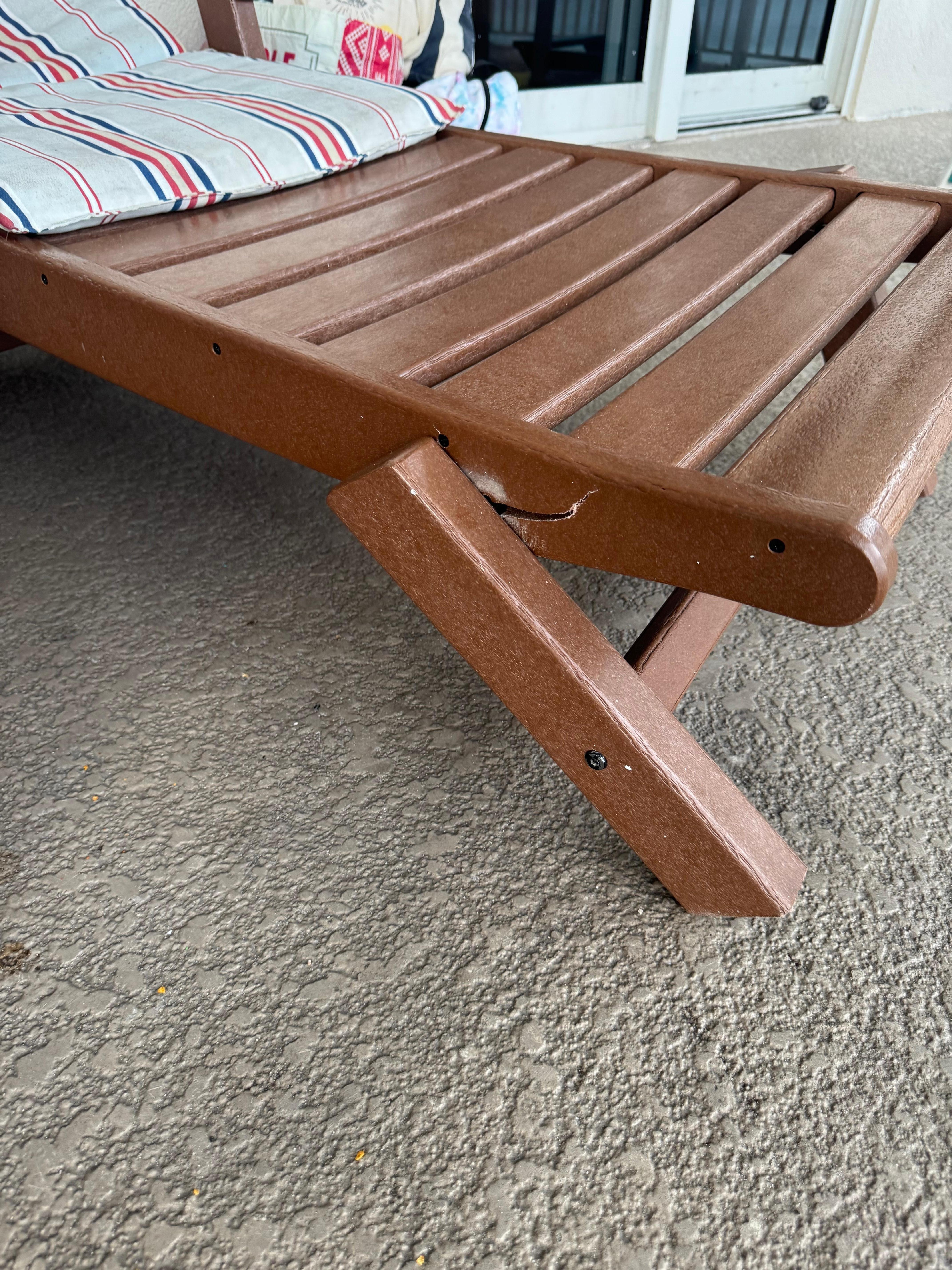 Broken chair and thin moldy cushions