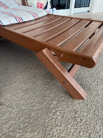 Broken chair and thin moldy cushions