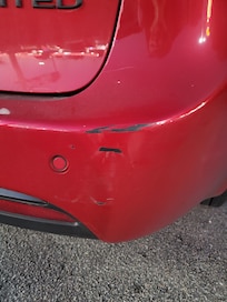 People don't know how to park in the parking garage. They ran into my car