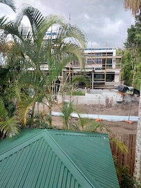 This is the building being constructed outside both bedroom windows and deck area.