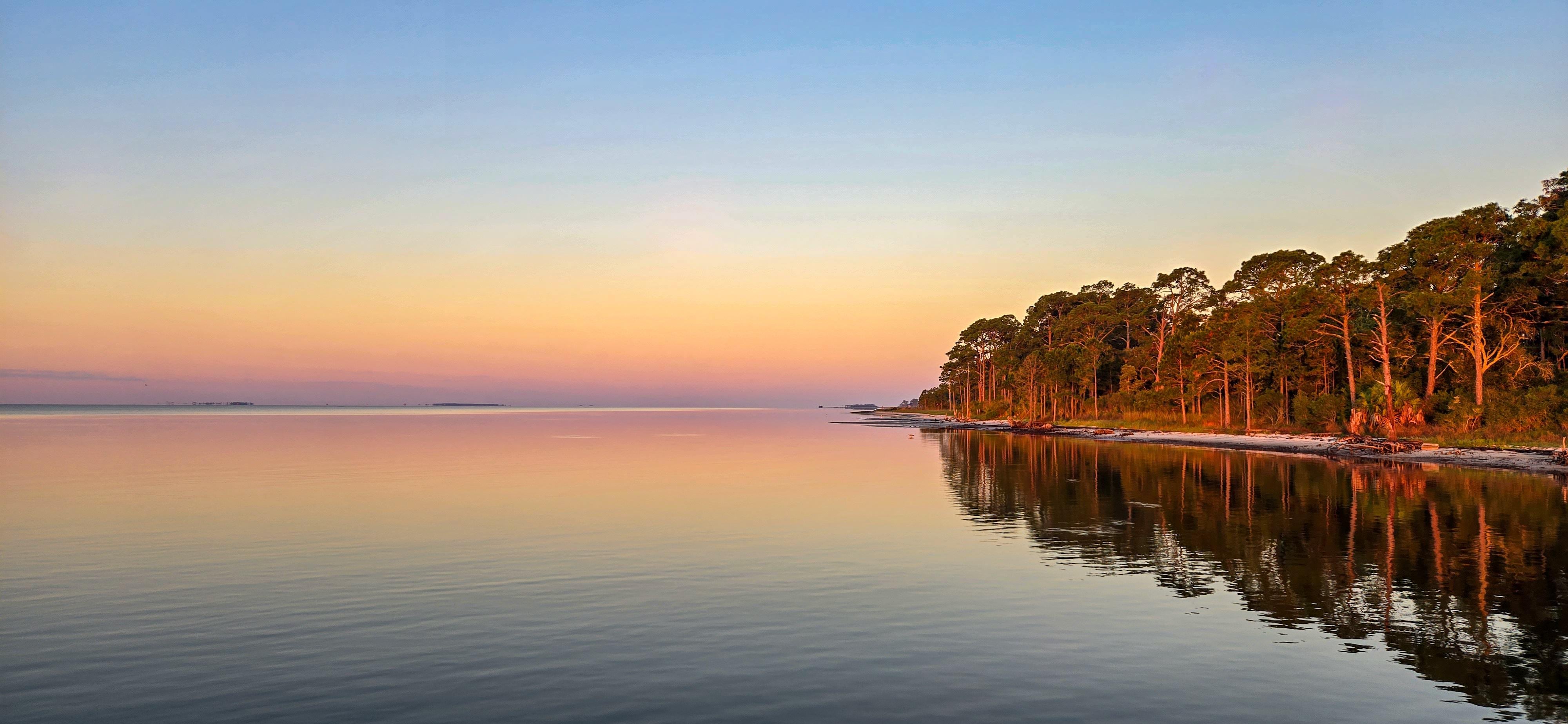 Sunrise on the beach in front of the homr.