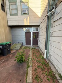 The right hand door is the entrance to the stairwell
