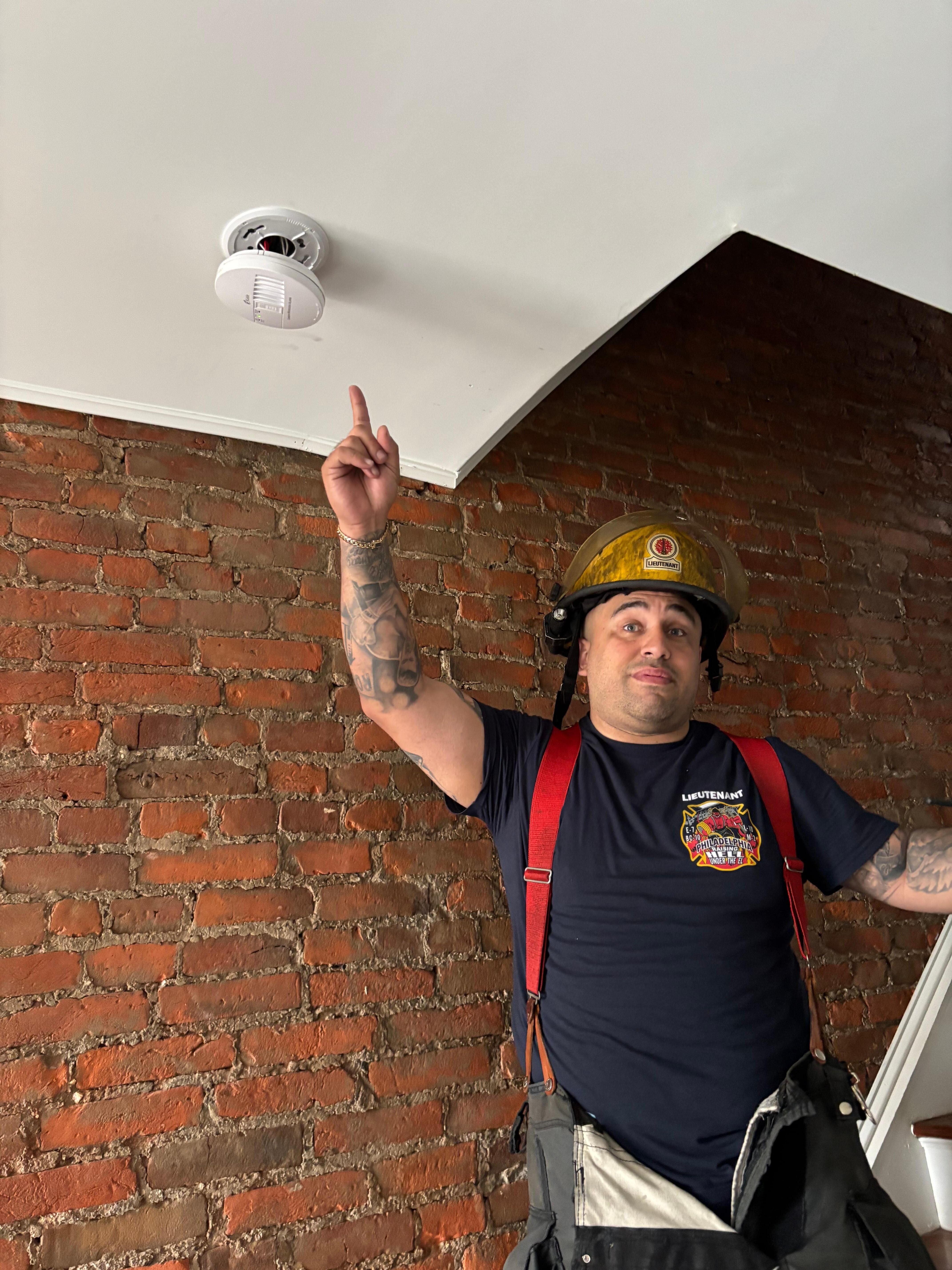 FD checking out the carbon monoxide alarm.