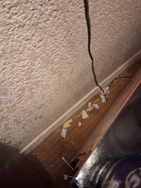 View behind the nightstand at checkin