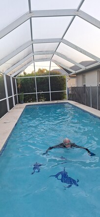 Lapswimmer in screened pool area. 40 ft by 18 ft across
