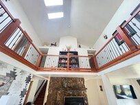 Beautiful family gathering area with loft overlooking