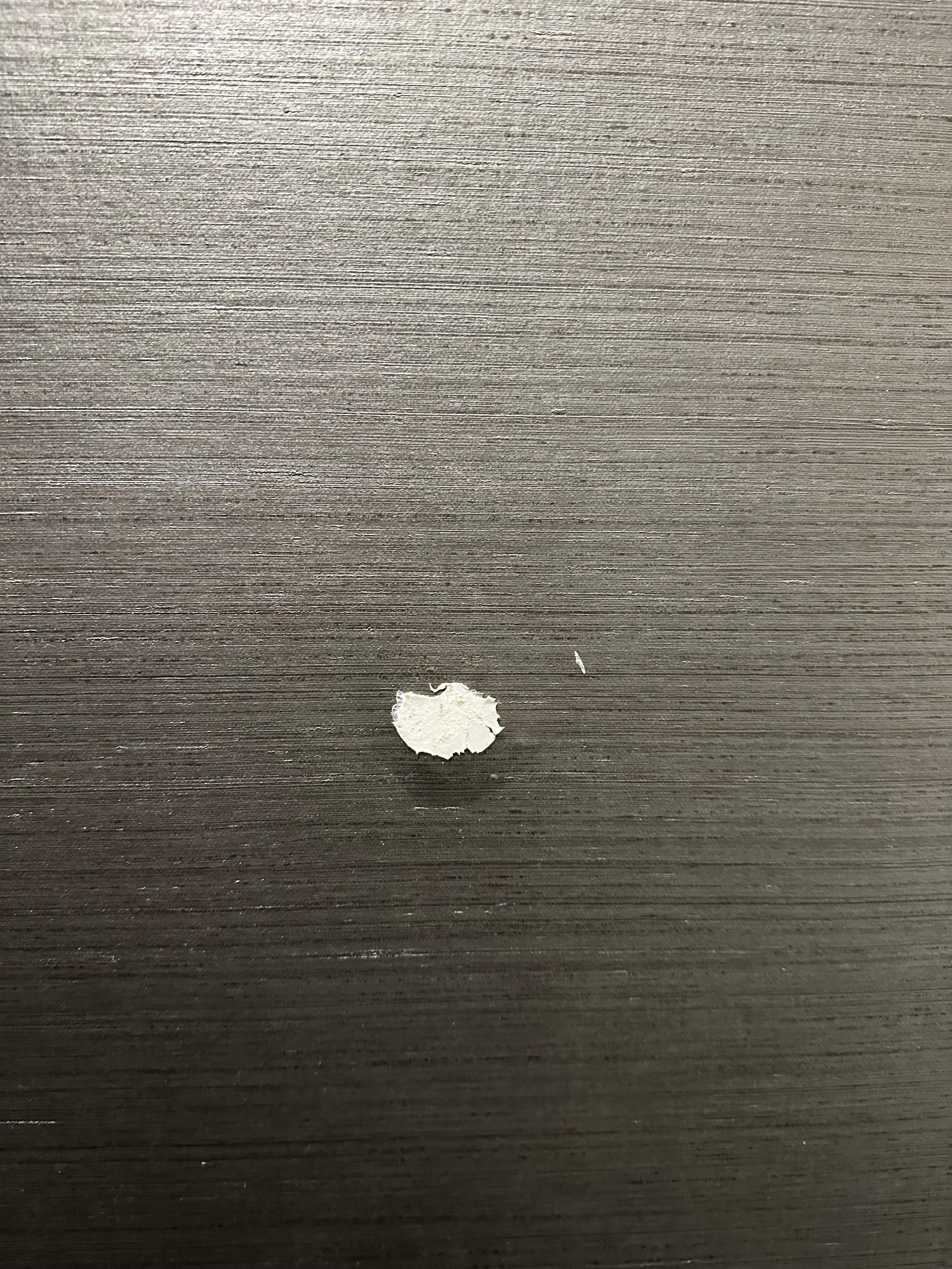 Wall where the door handle had been pushed through it