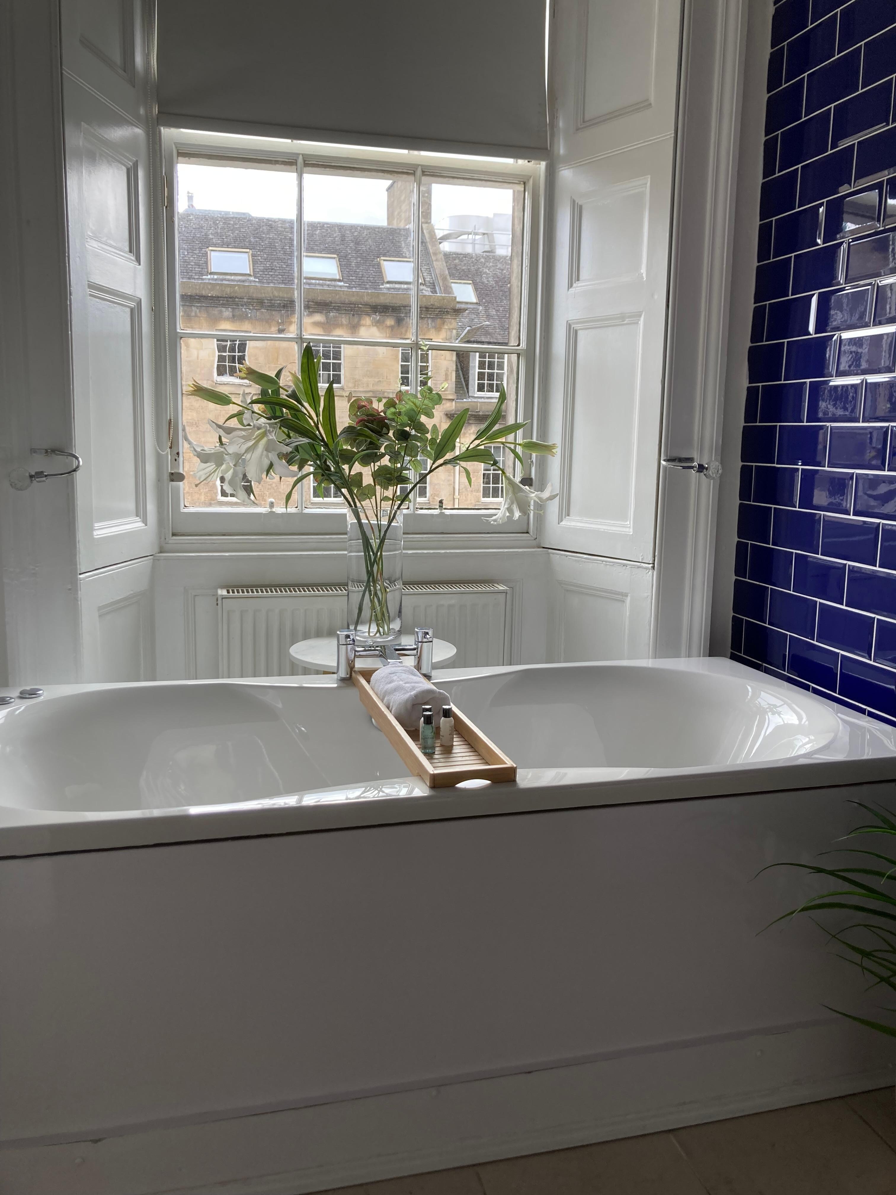 Bathroom is big and bright.