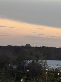 An evening view from the hallway with Chichen Itza in the background. The hotel is less than a 10 minute drive to Chichen Itza.