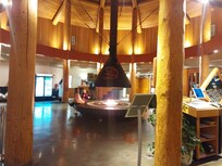Warm + inviting reception area with restaurant just off to the side