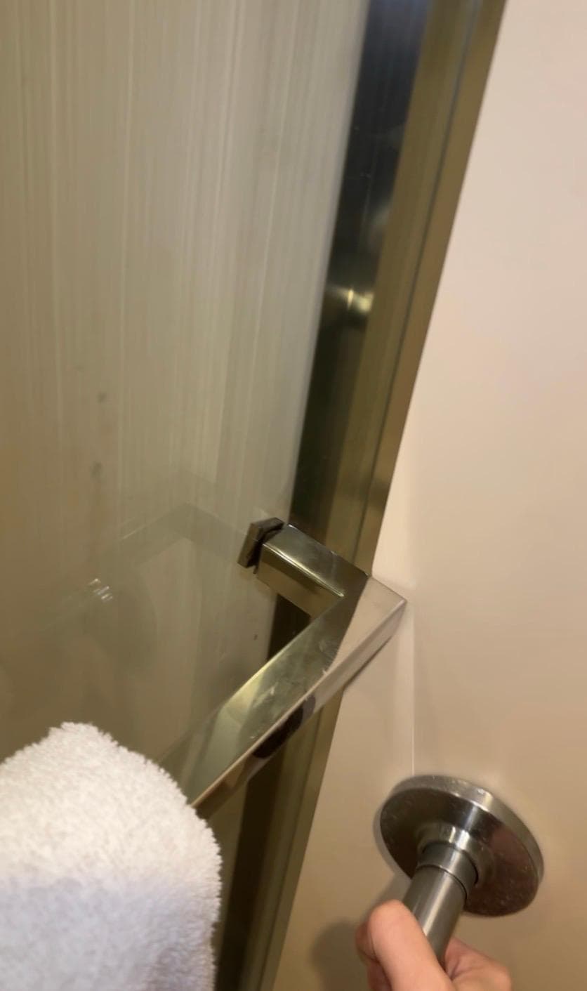 Bathroom door couldn’t close without opening the shower door