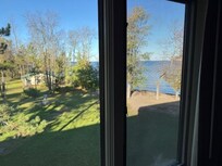 To see this view, you have to stand at the window and look toward the lake. From inside the room, you only see the neighbor's property.