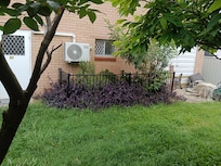 Here's another picture of the backyard there's a fence over by the bathroom window at least you know there are no peeping toms anymore