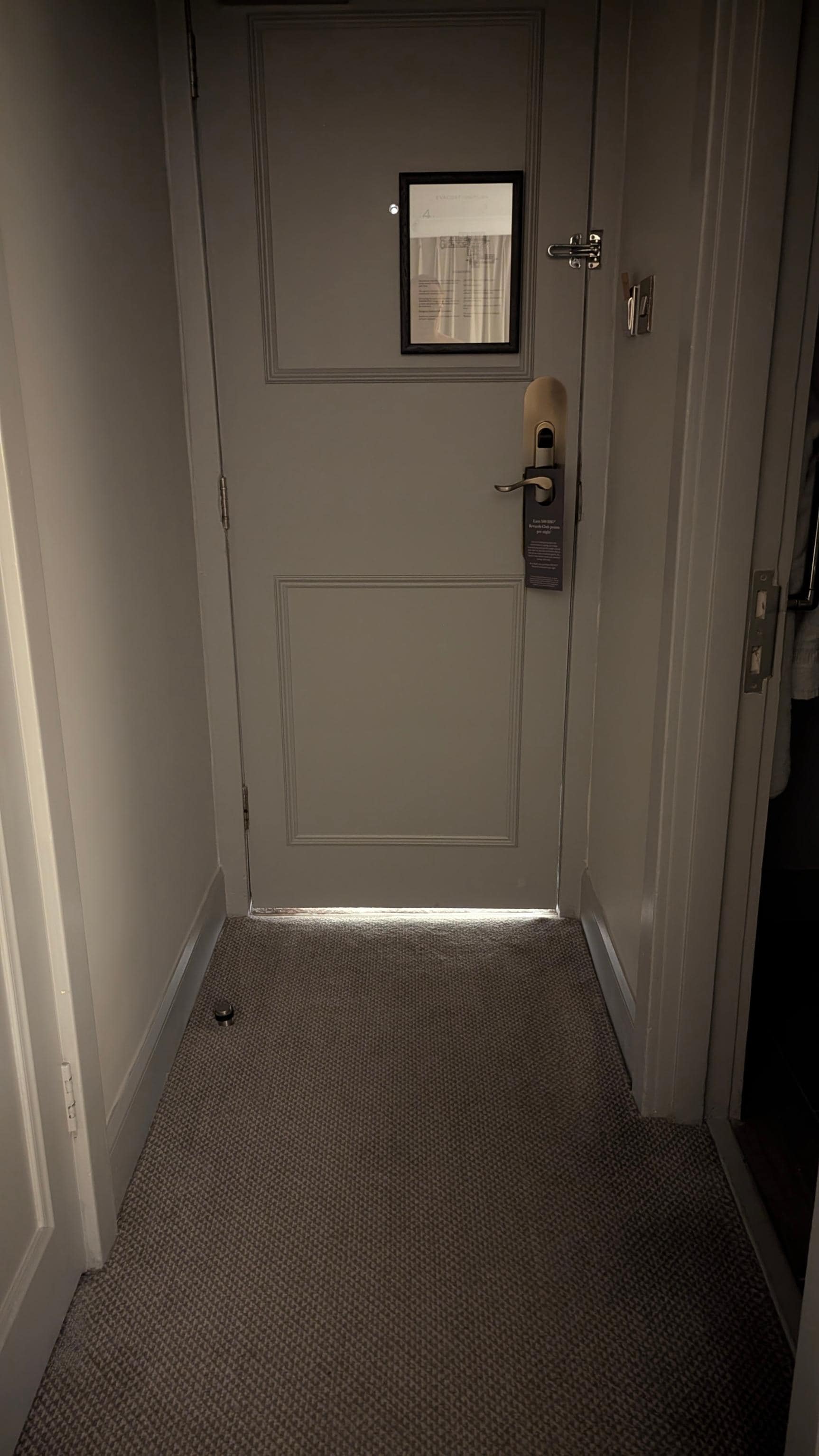 Gap under door allowing in corridor light and noise.