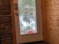 A view of the waterfall through the door while sitting on the sofa.