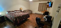 Inside the only room other than the bathroom...