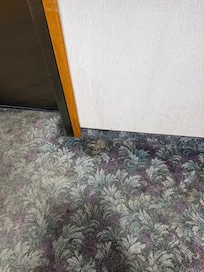 Stain on walls and floors. This is area by the elevator