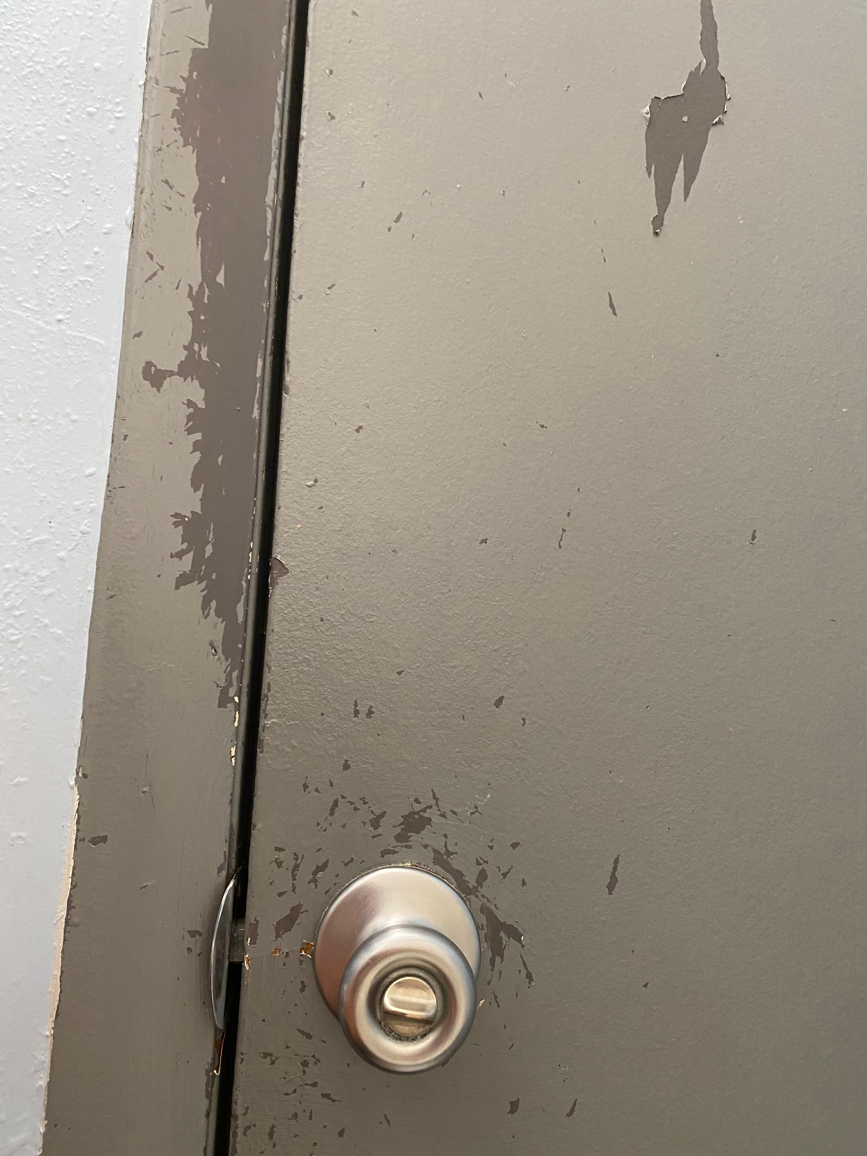 Bathroom door from the inside. Paint pealing