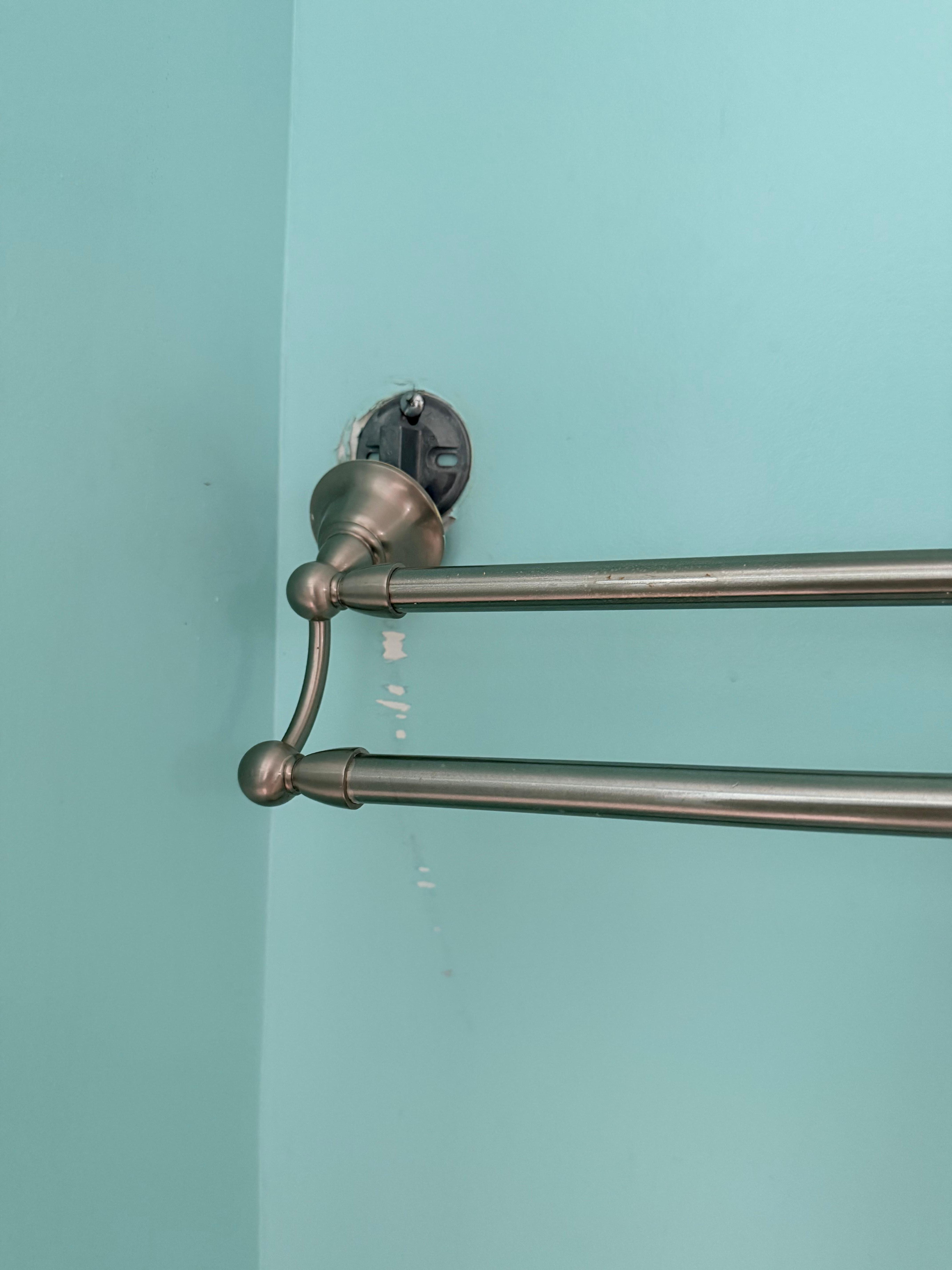 Towel rack above toilet. 