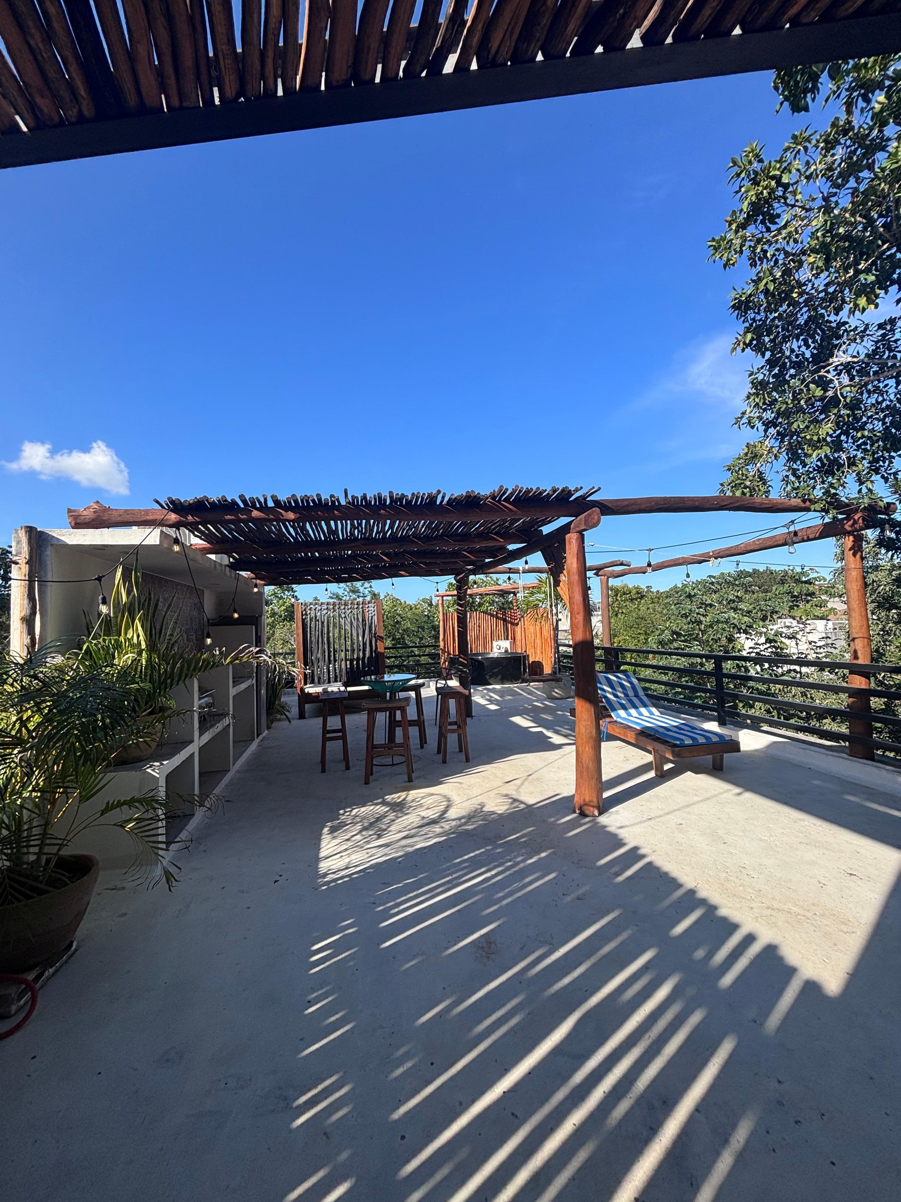 Rooftop patio. You have to go outside to enter upstairs bedroom. 