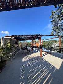 Rooftop patio. You have to go outside to enter upstairs bedroom.