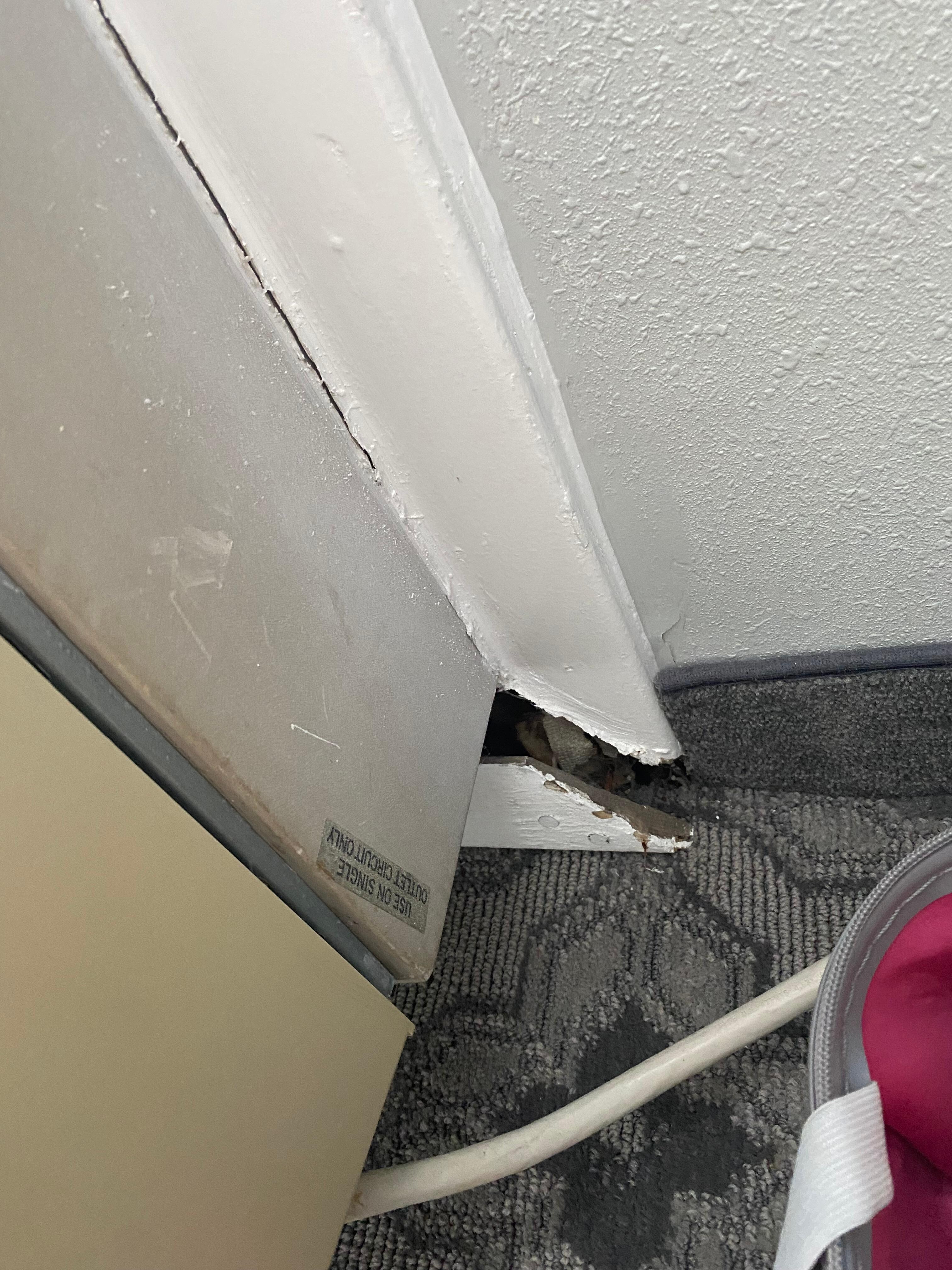 Next to air conditioner
