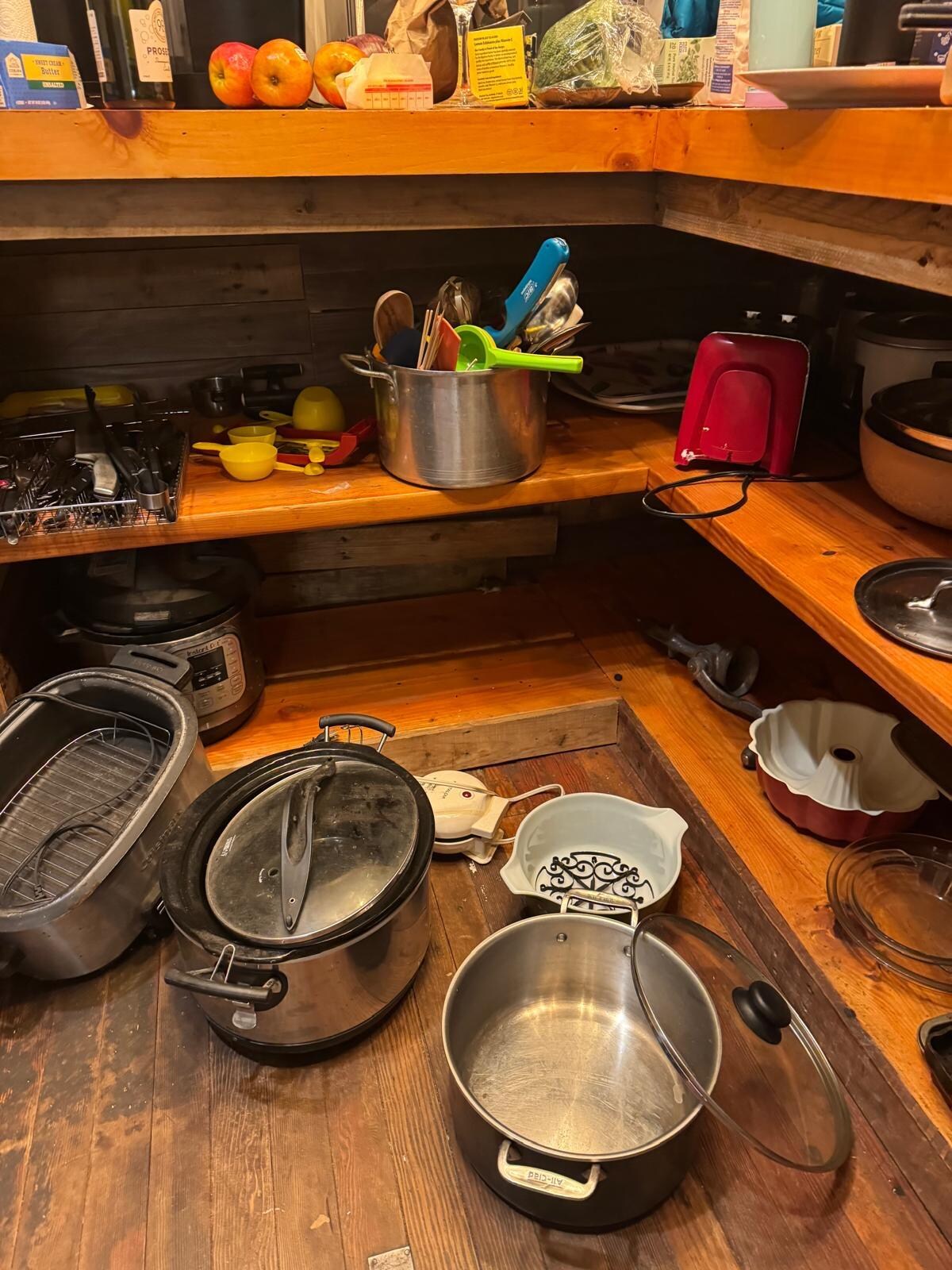 mouse in the kitchen storage area. zoom to bottom shelf, middle